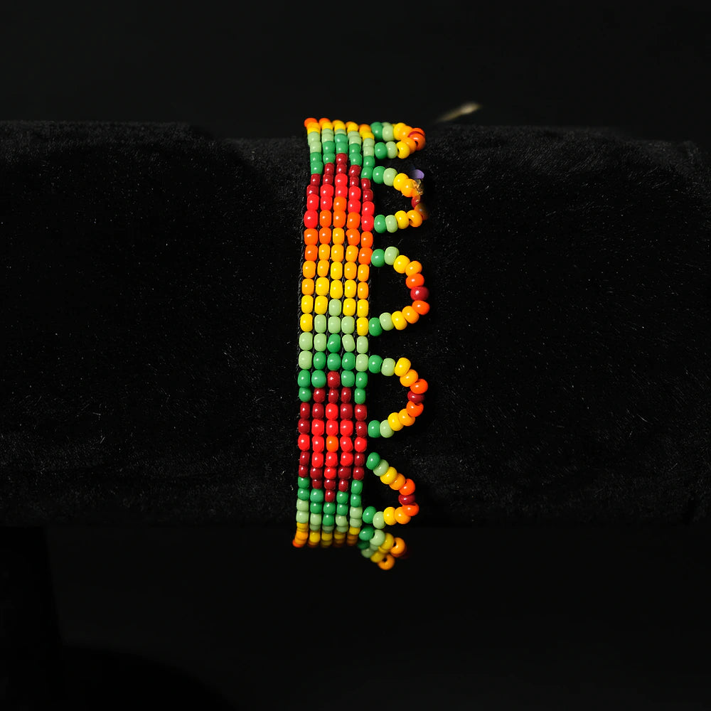 Pulsera artesanal de mostacillas Fuego Solar rojo verde amarillo naranja boho ajustable hecha a mano C7-07