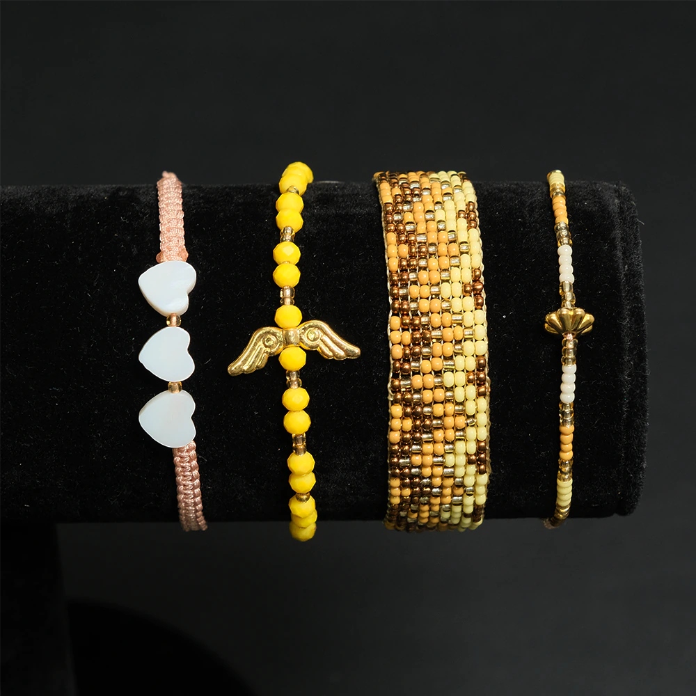 Juego Golden Sunset Wings de Pulseras Multicapas con Alas y Corazones E2-23